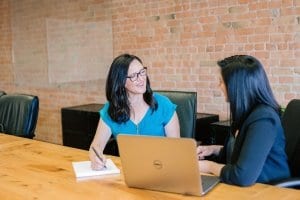 two women discussing Updates to the ICF Core Competencies